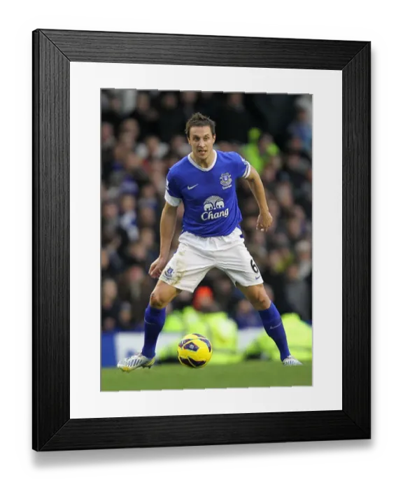 Framed Print : Everton vs. Chelsea: Phil Jagielka Faces Off in Barclays Premier League Clash at Goodison Park (30-12-2012)