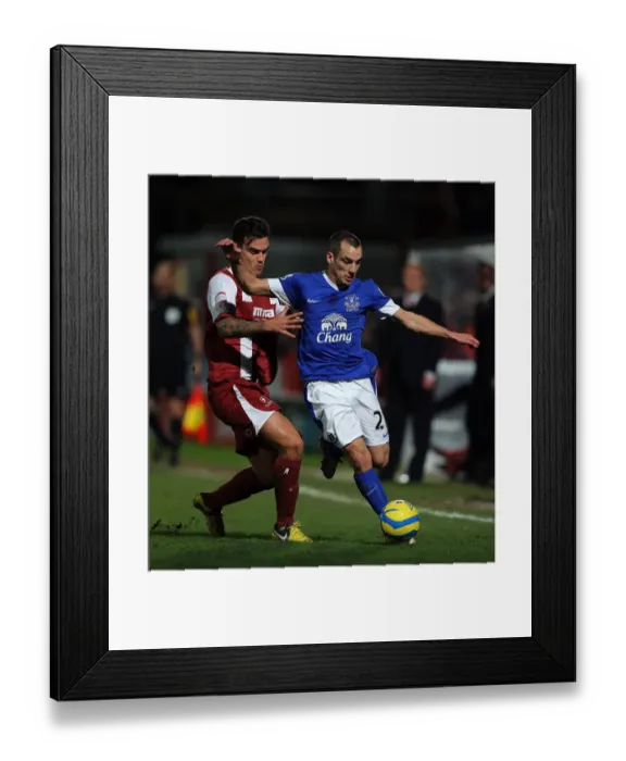 Framed Print : FA Cup Third Round Showdown: Leon Osman vs Marlon Pack Battle at Whaddon Road Framed Print : FA Cup Third Round Showdown: Leon Osman vs Marlon Pack Battle at Whaddon Road