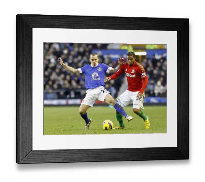 Framed Print : Battle for the Ball: Osman vs. Agustien - Everton vs. Swansea City, Premier League Rivalry (12-01-2013) Framed Print : Battle for the Ball: Osman vs. Agustien - Everton vs. Swansea City, Premier League Rivalry (12-01-2013)