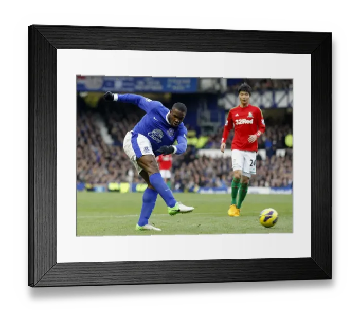 Framed Print : Anichebe's Determined Shot: Everton vs Swansea City, Barclays Premier League, Goodison Park (12-01-2013) Framed Print : Anichebe's Determined Shot: Everton vs Swansea City, Barclays Premier League, Goodison Park (12-01-2013)