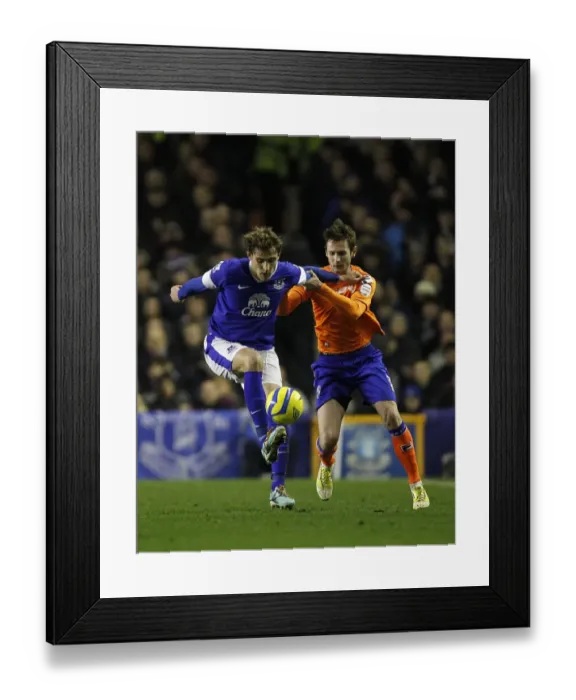 Framed Print : Jelavic vs Grounds: Battle for FA Cup Possession at Goodison Park (Everton 3-1 Oldham Athletic, Round 5 Replay)