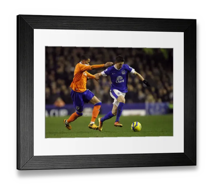 Framed Print : Intense Battle: Mirallas vs Brown in Everton's FA Cup Fifth Round Replay Win Against Oldham Athletic (26-02-2013)