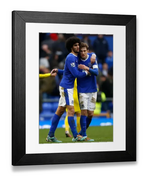 Framed Print : Everton's Triumph: Fellaini and Jelavic's Embrace (3-1 vs Reading, Barclays Premier League - March 2, 2013) Framed Print : Everton's Triumph: Fellaini and Jelavic's Embrace (3-1 vs Reading, Barclays Premier League - March 2, 2013)