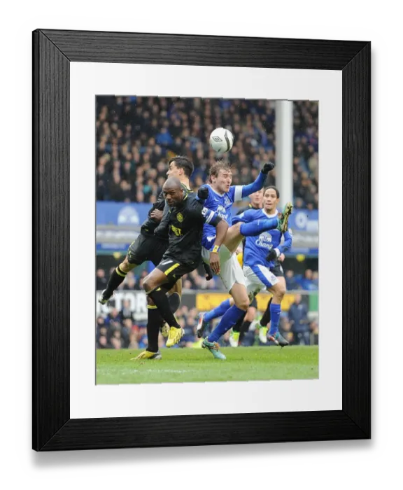 Framed Print : Clash in the Quarter-Finals: Jelavic vs. Boyce and Scharner - Everton vs. Wigan Football Rivalry