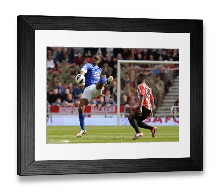Framed Print : Distin vs Sessegnon: A Premier League Showdown at Stadium of Light (Everton 0-1 Sunderland, 20-04-2013) Framed Print : Distin vs Sessegnon: A Premier League Showdown at Stadium of Light (Everton 0-1 Sunderland, 20-04-2013)