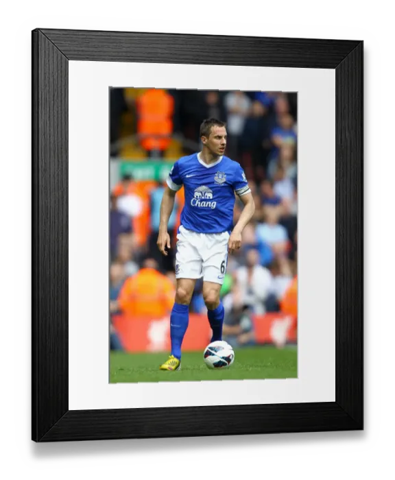 Framed Print : Rivalry Unyielding: Phil Jagielka's Defiant Stand in the 0-0 Liverpool vs. Everton Battle at Anfield (May 5, 2013) Framed Print : Rivalry Unyielding: Phil Jagielka's Defiant Stand in the 0-0 Liverpool vs. Everton Battle at Anfield (May 5, 2013)