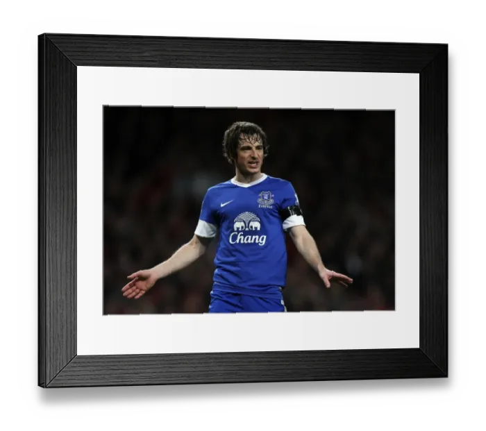 Framed Print : Defensive Showdown: Leighton Baines Stands Firm as Everton Holds Arsenal Scoreless (16-04-2013)