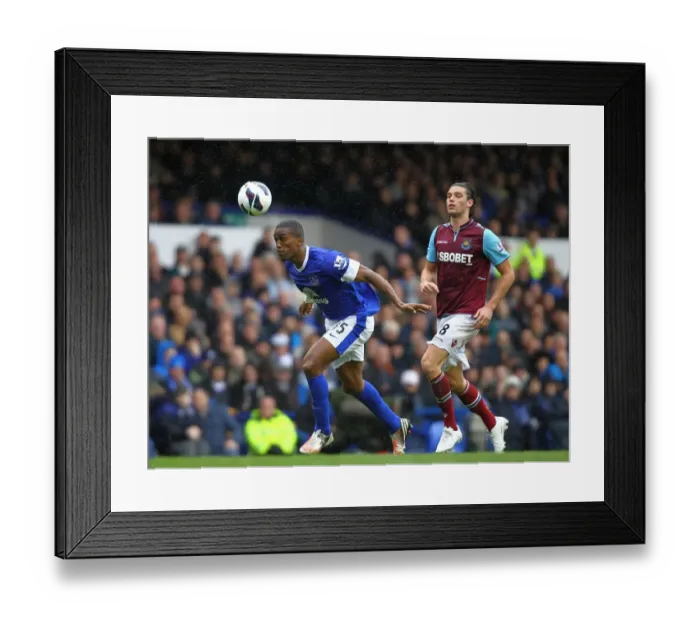 Framed Print : Battle at Goodison Park: Distin vs. Carroll - Everton vs. West Ham United (12-05-2013) Framed Print : Battle at Goodison Park: Distin vs. Carroll - Everton vs. West Ham United (12-05-2013)