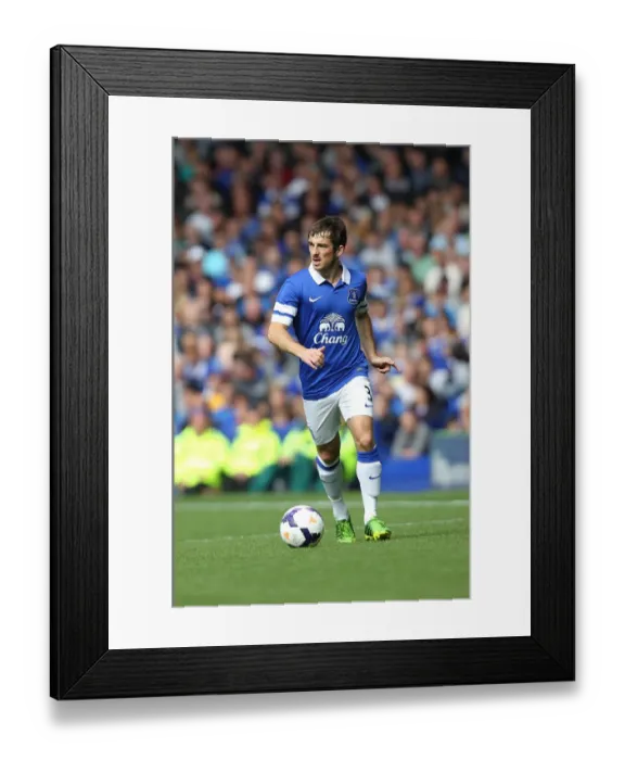 Framed Print : Everton's Leighton Baines Leads Team to 2-1 Pre-Season Victory Over Real Betis (11-08-2013)
