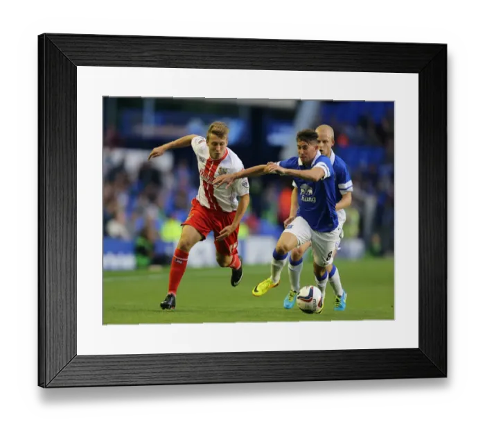 Framed Print : Battling for Control: Oviedo vs. Freeman in Everton's Capital One Cup Showdown against Stevenage Framed Print : Battling for Control: Oviedo vs. Freeman in Everton's Capital One Cup Showdown against Stevenage