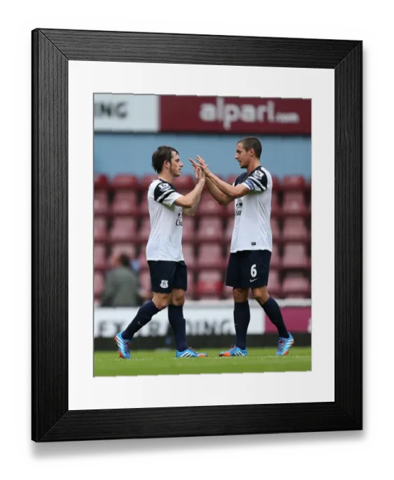 Framed Print : Everton's Triumph: Baines and Jagielka's Jubilant Moment at Upton Park after Everton's 3-2 Victory over West Ham United (September 21, 2013, Barclays Premier League) Framed Print : Everton's Triumph: Baines and Jagielka's Jubilant Moment at Upton Park after Everton's 3-2 Victory over West Ham United (September 21, 2013, Barclays Premier League)