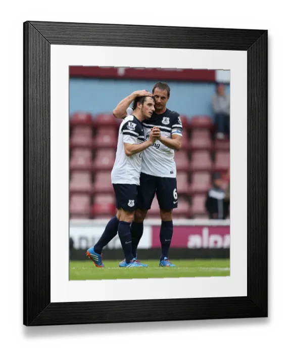 Framed Print : Everton's Glory: Leighton Baines and Phil Jagielka Celebrate a Thrilling 3-2 Victory over West Ham in the Premier League (September 21, 2013) Framed Print : Everton's Glory: Leighton Baines and Phil Jagielka Celebrate a Thrilling 3-2 Victory over West Ham in the Premier League (September 21, 2013)