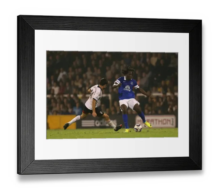 Framed Print : Battling for Control: Lukaku vs. Karagounis in the Capital One Cup Showdown at Craven Cottage Framed Print : Battling for Control: Lukaku vs. Karagounis in the Capital One Cup Showdown at Craven Cottage