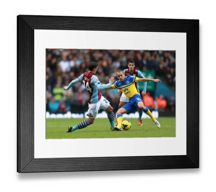 Framed Print : Battle for the Ball: Tonev vs. Osman in Aston Villa vs. Everton's Intense Premier League Clash at Villa Park (26-10-2013) Framed Print : Battle for the Ball: Tonev vs. Osman in Aston Villa vs. Everton's Intense Premier League Clash at Villa Park (26-10-2013)