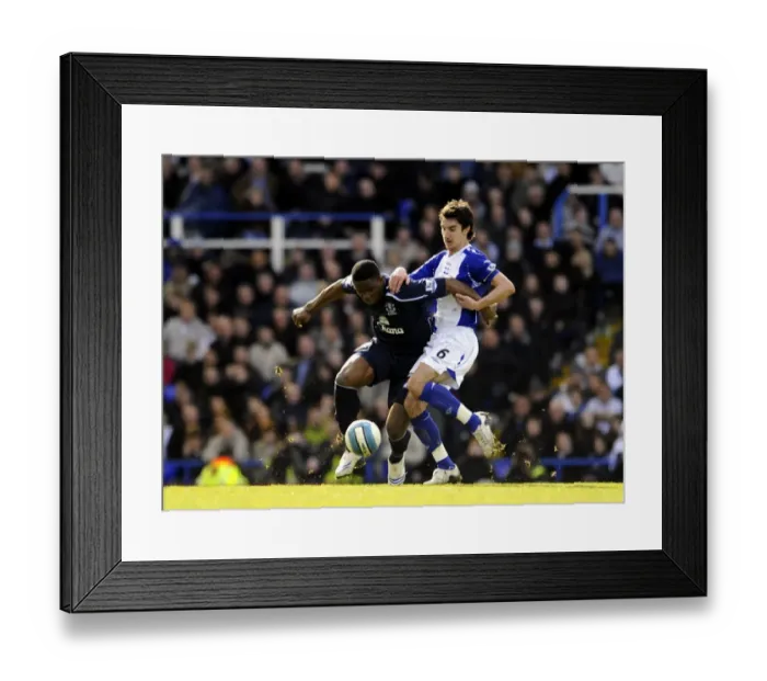 Framed Print : Ridgewell vs. Yakubu: Intense Action in Birmingham vs. Everton Barclays Premier League Match Framed Print : Ridgewell vs. Yakubu: Intense Action in Birmingham vs. Everton Barclays Premier League Match