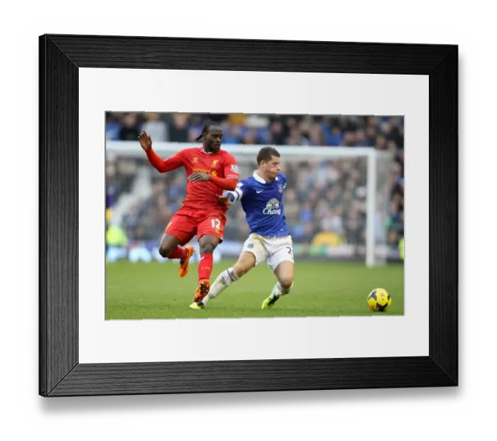 Framed Print : Intense Rivalry: Ross Barkley vs. Victor Moses - Everton vs. Liverpool's Thrilling 3-3 Battle for Ball Possession (November 2013, Goodison Park) Framed Print : Intense Rivalry: Ross Barkley vs. Victor Moses - Everton vs. Liverpool's Thrilling 3-3 Battle for Ball Possession (November 2013, Goodison Park)