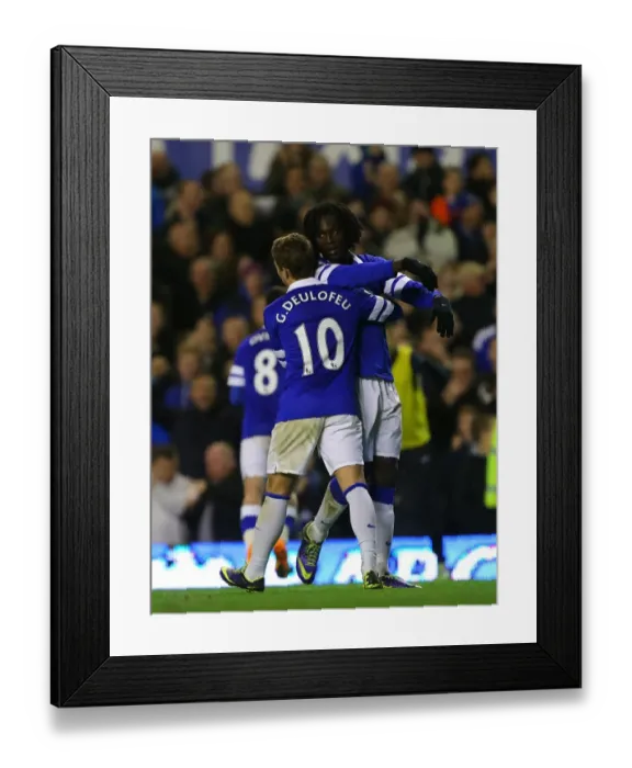 Framed Print : Four-Goal Blitz: Lukaku and Deulofeu Celebrate Everton's Dominance Over Stoke City (30-11-2013)