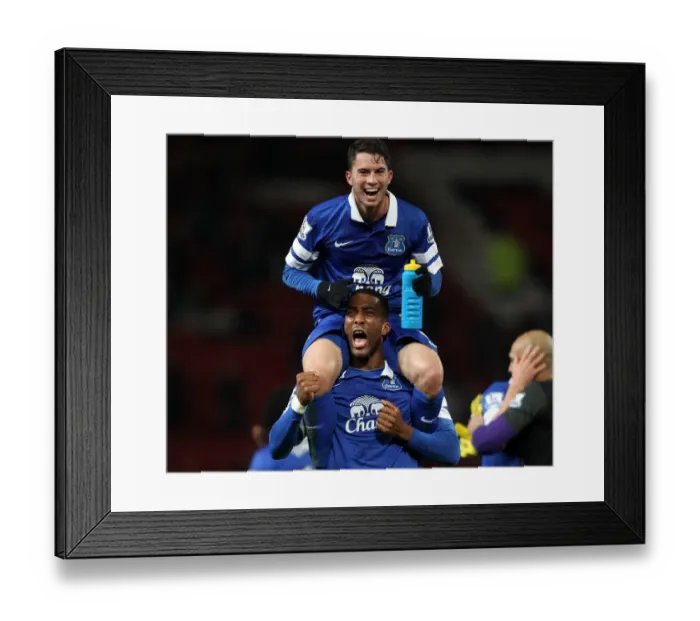 Framed Print : Everton's Historic Victory: Oviedo and Distin Celebrate Over Manchester United (0-1) Framed Print : Everton's Historic Victory: Oviedo and Distin Celebrate Over Manchester United (0-1)