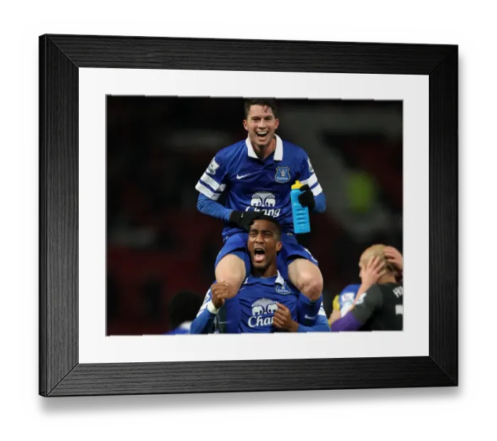 Framed Print : Everton's Historic Upset: Oviedo and Distin Celebrate 1-0 Victory at Old Trafford (December 4, 2013, Barclays Premier League) Framed Print : Everton's Historic Upset: Oviedo and Distin Celebrate 1-0 Victory at Old Trafford (December 4, 2013, Barclays Premier League)