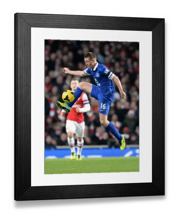 Framed Print : James McCarthy vs Arsenal: Intense Face-Off at Emirates Stadium in Everton's 1-1 Barclays Premier League Battle (December 8, 2013)