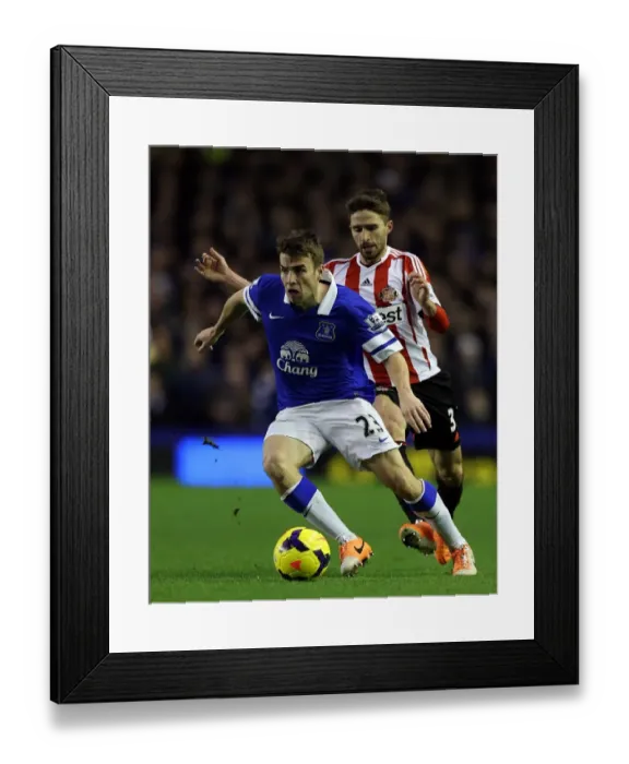 Framed Print : Battle at Goodison Park: A Clash Between Everton's Seamus Coleman and Sunderland's Fabio Borini (Everton 0 - Sunderland 1, December 26, 2013)