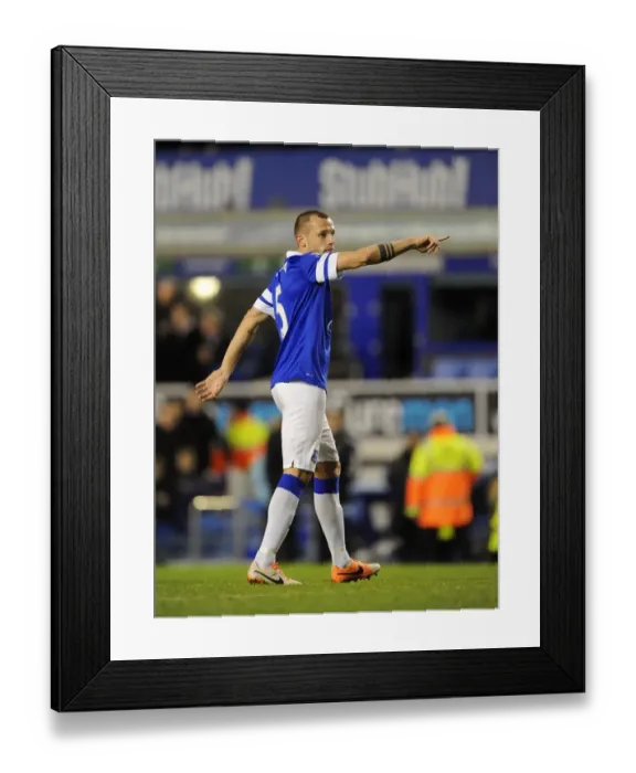 Framed Print : Johnny Heitinga's Triumphant Moment: Everton's 2-0 Victory Over Norwich City (BPL, Goodison Park, 11-01-2014)