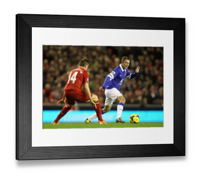 Framed Print : Clash at Anfield: Henderson vs. McGeady - Liverpool's Dominant 4-0 Victory over Everton (January 2014)