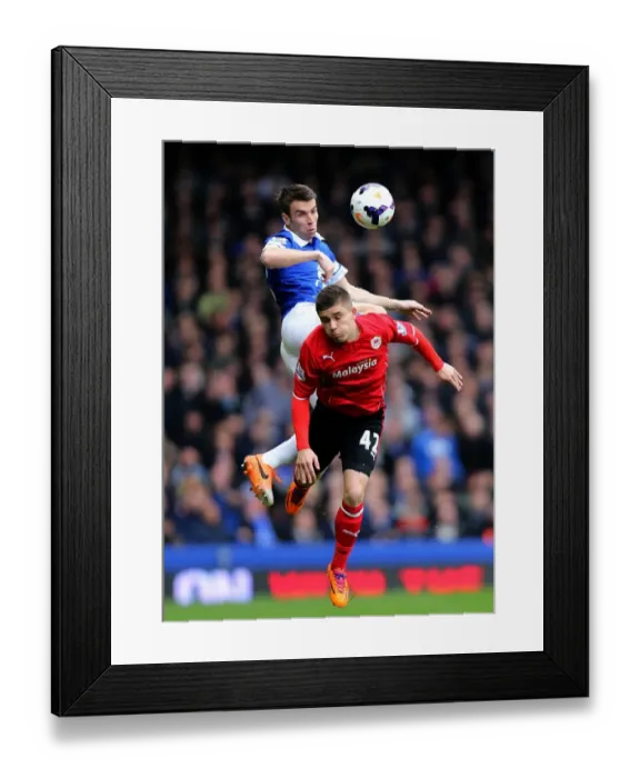 Framed Print : Seamus Coleman vs. Declan John: A Battle for the Ball in Everton's 2-1 Victory over Cardiff City