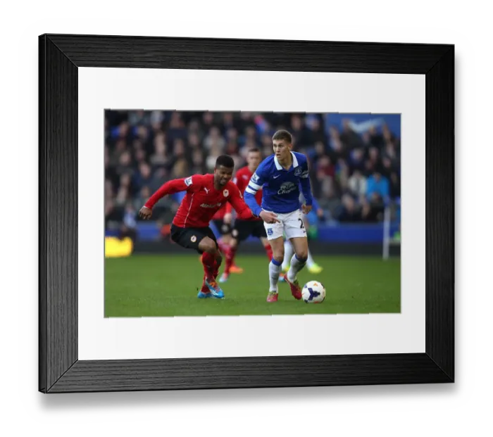 Framed Print : Battle for the Ball: Stones vs. Campbell - Everton's Narrow Victory over Cardiff City (15-03-2014)