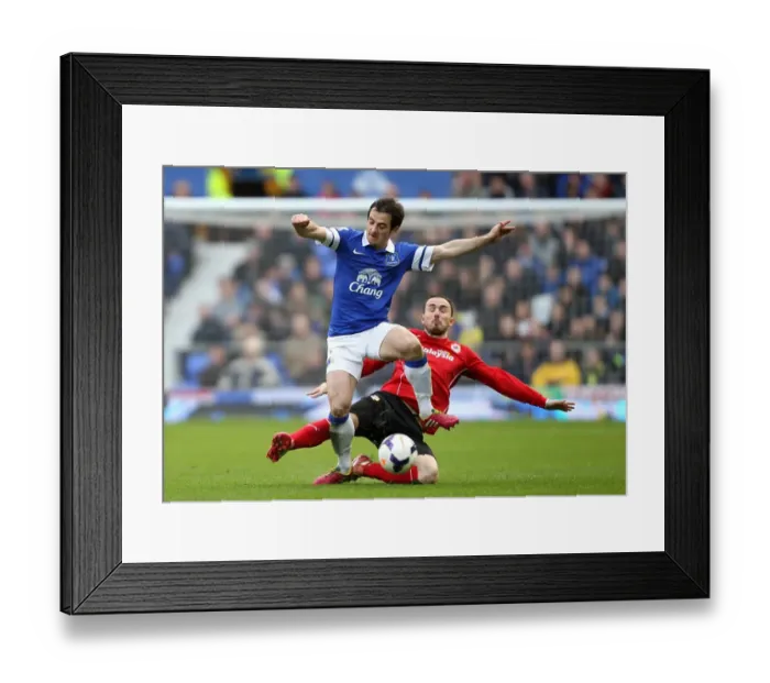 Framed Print : Intense Rivalry: Leighton Baines vs Jordon Mutch - Everton vs Cardiff City, Barclays Premier League (Everton 2 - Cardiff City 1, Goodison Park, 15-03-2014)