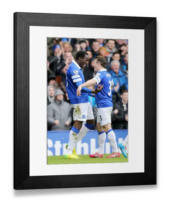 Framed Print : Everton's Double Strike: Lukaku and Baines Celebrate at Goodison Park
