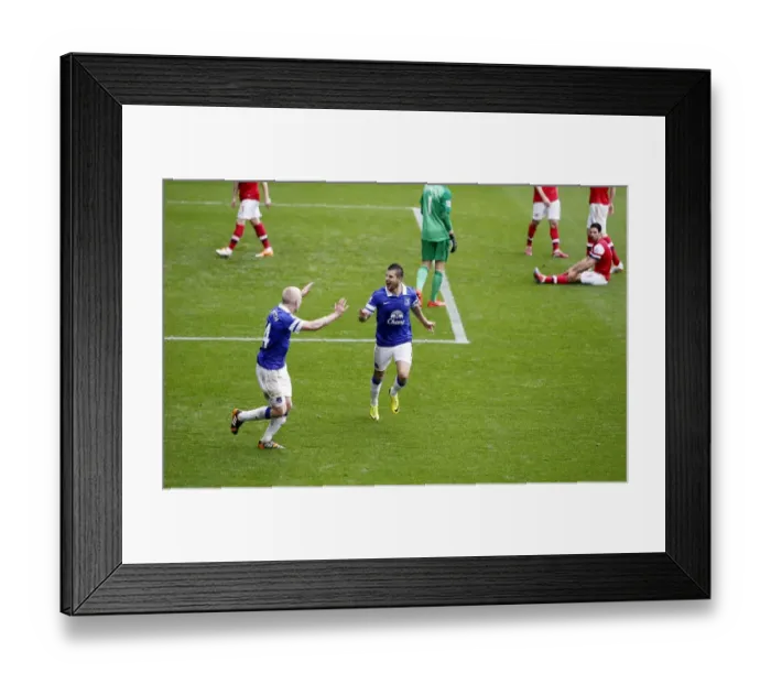 Framed Print : Triumphant Everton: Mirallas, Naismith Celebrate Arteta's Own Goal (3-0 vs Arsenal, Goodison Park, 06-04-2014)