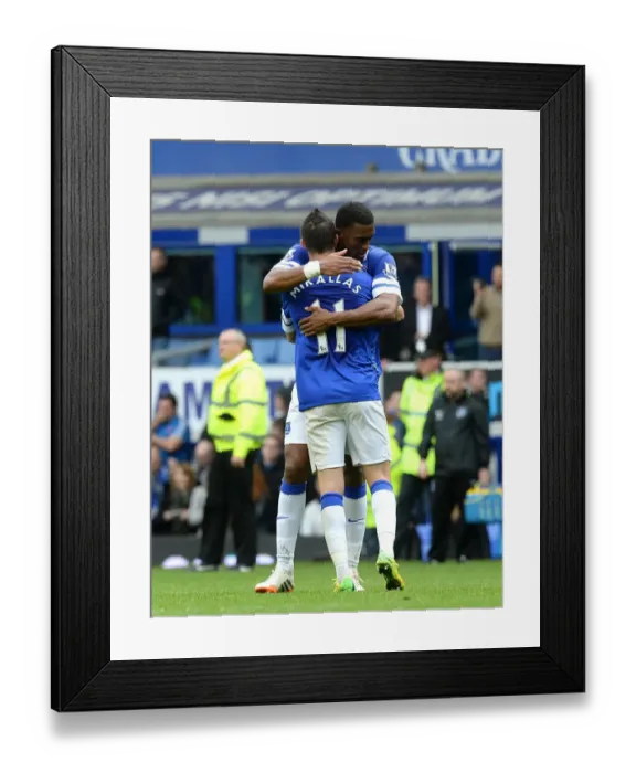 Framed Print : Everton's Triumph: Mirallas and Distin's Embrace - Everton's 3-0 Victory Over Arsenal (Barclays Premier League, Goodison Park, 06-04-2014)