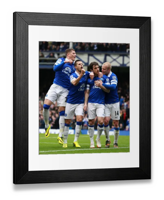 Framed Print : Leighton Baines Scores Penalty: Everton Takes 1-0 Lead Over Manchester United (Barclays Premier League, 21-04-2014)