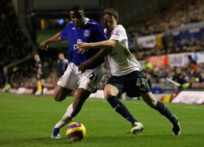 Framed Print : Anichebe vs. Gunter: Everton vs. Tottenham Clash in Barclays Premier League (January 30, 2008)