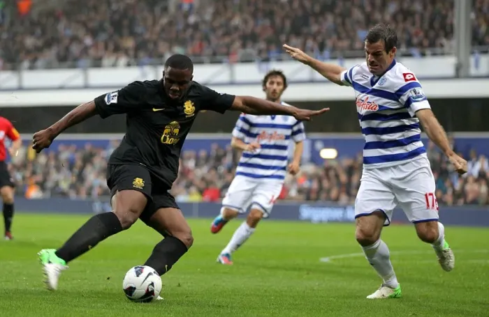 Framed Print : Anichebe vs. Nelsen: A Tight Battle for the Goal - Everton vs. Queens Park Rangers, Premier League