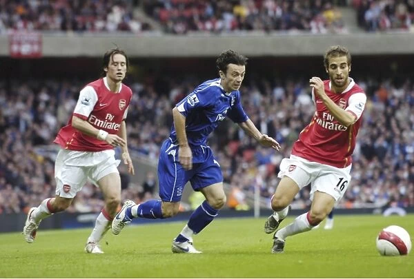 Arsenal v Everton Arsenals Mathieu Flamini and Evertons Simon Davies in action