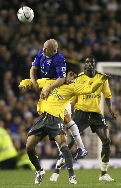 Arsenals Denilson challenges Evertons Carsley for the ball in Liverpool