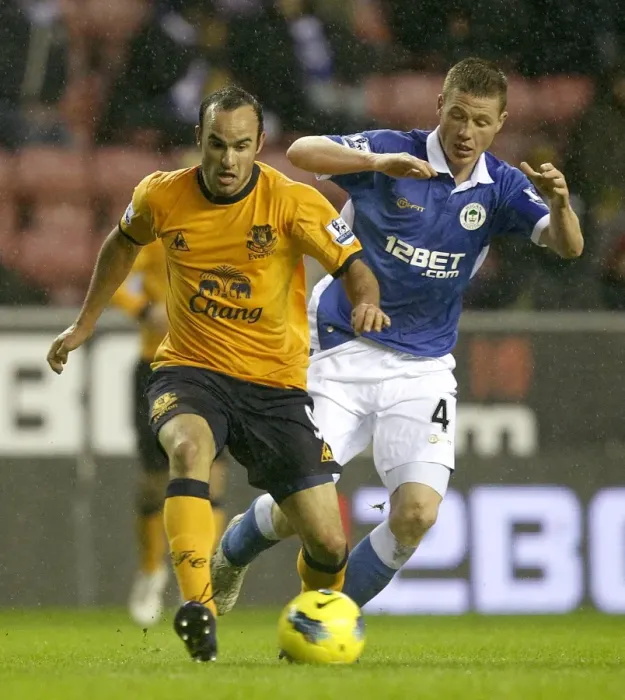 Framed Print : Battle for the Ball: Donovan vs. McCarthy - Everton vs. Wigan Athletic (February 2012)