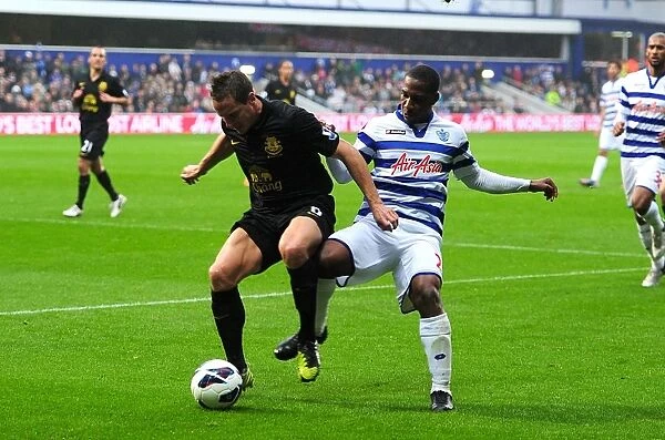 Battle for the Ball: Jagielka vs Hoilett in Everton's Draw with Queens Park Rangers (BPL 2012)