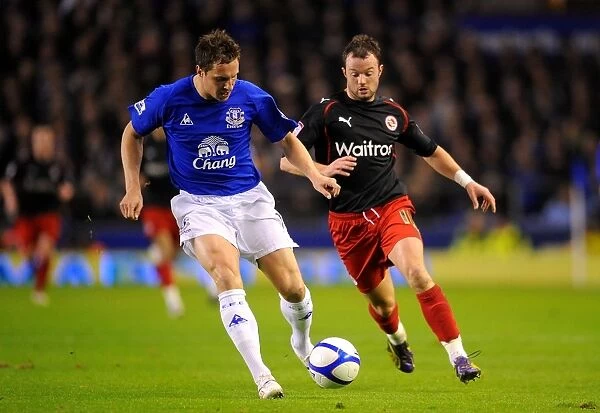 Battle for the Ball: Jagielka vs. Hunt - Everton's FA Cup Fifth Round Intense Rivalry (March 1, 2011)