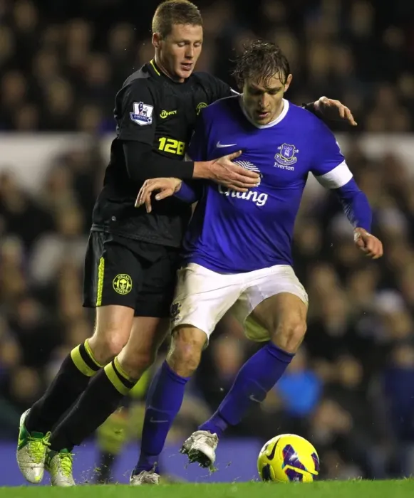Framed Print : Battle for the Ball: McCarthy vs. Jelavic at Goodison Park - Everton vs. Wigan Athletic (December 26, 2012: Everton 2-1) Framed Print : Battle for the Ball: McCarthy vs. Jelavic at Goodison Park - Everton vs. Wigan Athletic (December 26, 2012: Everton 2-1)