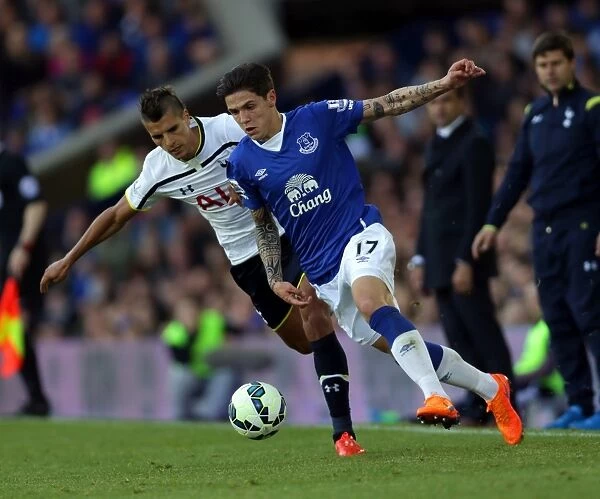 Battle for the Ball: Muhamed Besic vs. Erik Lamela - Everton vs. Tottenham Rivalry at Goodison Park