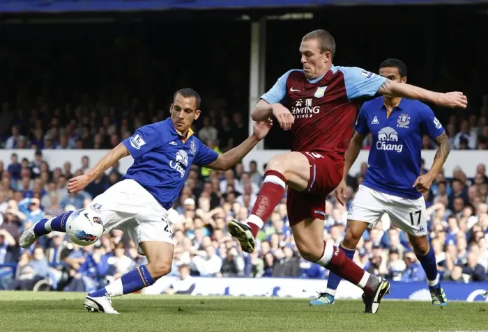 Framed Print : Battle for the Ball: Osman vs. Dunne - Everton vs. Aston Villa, Premier League Rivalry (September 10, 2011)