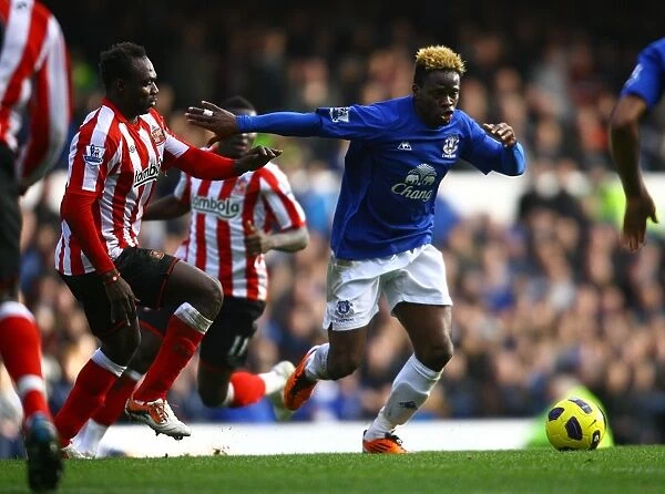 Battle for the Ball: Saha vs Mensah - Everton vs Sunderland's Intense Rivalry (Barclays Premier League, 26 February 2011)