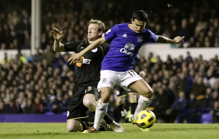 Framed Print : Battle for the Ball: Tim Cahill vs Steven Caldwell - Everton vs Wigan Athletic (Premier League, Goodison Park, 11 December 2010)