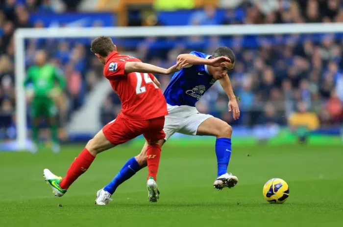 Framed Print : Battle at Goodison Park: A Riveting Tie Between Allen and Osman (Everton vs. Liverpool, Barclays Premier League)