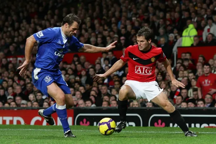 Framed Print : A Battle for Supremacy: Lucas Neill vs. Michael Owen - Manchester United vs. Everton Framed Print : A Battle for Supremacy: Lucas Neill vs. Michael Owen - Manchester United vs. Everton