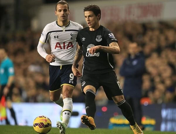 Battling for the Ball: Soldado vs. Besic - Premier League Showdown between Tottenham Hotspur and Everton