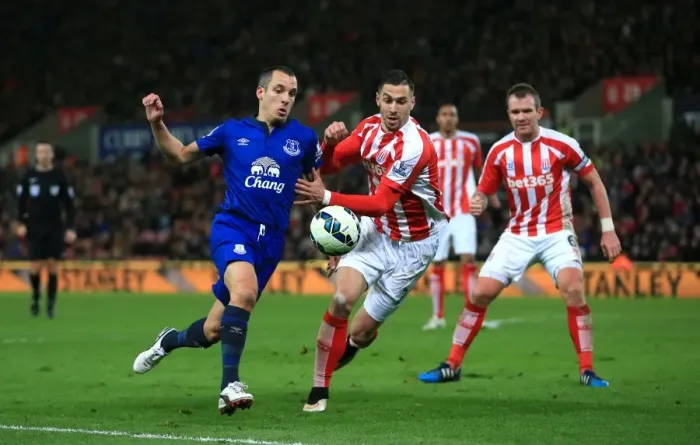 Framed Print : Battling for Ball Supremacy: Osman vs. Cameron at Britannia Stadium - Everton vs. Stoke City Framed Print : Battling for Ball Supremacy: Osman vs. Cameron at Britannia Stadium - Everton vs. Stoke City